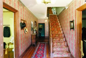 Photo shows the narrow staircase in the William Heath Davis House, where the Victorian couple is said to stand. 